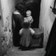 SMALL GIRLS GOING DOWN THE STAIRS -WAR TIME BRICKS